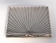 Evald Nielsen. 
Silver 
cigarette case 
(830). Length 
10.5 cm. Width 
9 cm