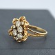 A 14k gold ring 
with 4 big 
brillants and 3 
smaller. 4 big 
brillants: 
Total app. 1,00 
ct. Colour: ...