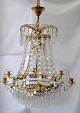Large prism 
ceiling 
chandelier, 
20th century. 
Brass with 
prisms. For 6 
candles. For 6 
small ...