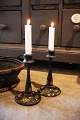 A pair of old 
Swedish wooden 
candlesticks 
painted with 
floral motifs. 
The 
candlesticks 
have a ...