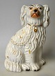 Staffordshire 
dog figure, 
earthenware, 
19th century 
England. With 
painting and 
gilding. Stamp 
...