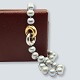 Ole Lynggaard; 
"Fidelity" 
jewellery clasp 
of 14k gold and 
white gold, set 
with two ...
