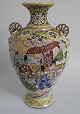 Satsuma vase, 
ca.1900. 
Polycrom 
decoration in 
the form of 
noblemen. With 
two handles 
like rising ...