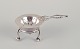 Georg Jensen, 
early tea 
strainer with 
holder. 830 
silver.
Model number 
10.
Marked with 
...