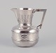 Anton 
Michelsen. 
Large Danish 
pitcher in 830 
silver. Art 
Nouveau style.
Wavy design 
featuring ...