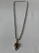 Silver necklace with Amber pendant
The necklace 44.5 cm long