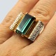 Gold ring set 
with a 
turmaline and 
diamonds