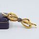 Brooch of 18k 
gold set with 
sapphires. 
Brooch in shape 
as a bow. L. 
6,8 cm. W. 1,5 
cm. 
Antik ...