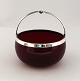 Svend Toxvärd. 
Red glass bowl 
with silver 
mounting (830). 
Diameter 10.5 
cm