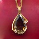 Long necklace 
in 14k gold, 
pendant set 
with a large 
topaz and two 
diamonds, total 
0.20 ...