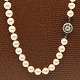 Hugo Grün; Long 
pearl necklace 
strung with 
knots between 
the pearls. 
From around ...