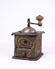 Antique coffee 
grinder from 
the 1890s made 
of metal and 
dark wood, 
decorated with 
a beautiful ...