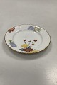 Royal 
Copenhagen No 
93. White Half 
Lace w. Flowers 
and Gold Cake 
Plate
Measures 
15,5cm / 6.10 
...
