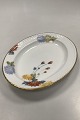 Royal 
Copenhagen No 
93. White Half 
Lace w. Flowers 
and Gold Oval 
Platter
Measures 30cm 
x 23,2cm ...