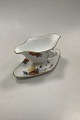 Royal 
Copenhagen No 
93 White Half 
Laced w. 
Flowers and 
Gold Gravy Boat
Measures 
24,5cm x 12,5cm 
...