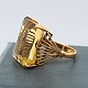 A cocktail ring of 18k gold set with a topaz A cocktail ring of 18k gold set with a topaz