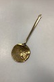 Antique brass 
skimming spoon 
with copper 
rivets. 
Somewhat bent 
and dented at 
the edge. 
Measures ...