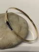 Bracelet in 14 
carat gold with 
white/black 
stone. The oval 
bangle is 
opened/closed 
by the ...