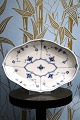 Royal 
Copenhagen Blue 
Fluted Plain 
oval asia. 
H: 3.2 cm. 
22.5x17cm. 
Decoration 
number: 1/147. 
...