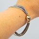 Ole Lynggaard; 
A bracelet of 
14k gold and 
silver set with 
"The Smile" 
clasp in 14k 
gold and ...