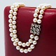 Hugo Grün; A 
pearl necklace 
with 14k white 
gold clasp, ...