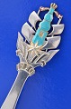 A. Michelsen 
Christmas 
cutlery, gilded 
sterlingsilver 
with an enamel 
motif. 
Christmas spoon 
from ...