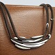 Anette Kræn for 
Georg Jensen; 
Large necklace 
in sterling 
silver with 
brown leather 
#310. ...