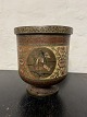 Brass flower 
pot. Decorates 
with four 
portraits. 
Signed on the 
bottom. 
Supposedly made 
in India. ...