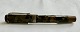 Octagonal 
“Cleaveland" 
brown marbled 
fountain pen 
From the 1930s. 
"Push button" 
ink refill. In 
...