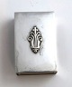 Georg Jensen. 
Silver (925). 
Acanthus. Small 
match holder. 
Length 4.3 cm. 
Width 3 cm.