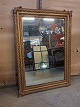 Guldmalet spejl 
fra 1900erne.
Det har 
brugsspor og 
defekter på 
hjørnerne.
Højde 83cm 
Bredde 59cm
