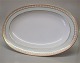 Thorvaldsen 
Bing and 
Grondahl : 
White base, 
light green 
border, gold 
decoration on 
the rim, form 
...