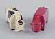 Kay Bojesen.
Two early 
wooden figures 
in the shape of 
cows.
