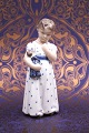 Royal 
Copenhagen 
porcelain 
figurine of a 
little girl 
with a doll on 
her arm. 
Height: 15cm. 
...