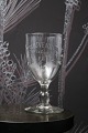 Old French 
souvenir wine 
glass with 
engraved 
writing and 
decorations. 
"Souvenir de la 
feté" ...