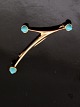 14 carat gold 
modern brooch 
with turquoises