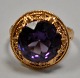 14 karats 
rødguldsring 
med brilliant 
slebet 
amethyst, ...