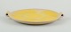 Finnish ceramic 
dish in Art 
Deco style. 
With two 
handles.
Yellow glaze. 
Hand painted. 
Marked ...
