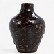 Axel Salto / 
Royal 
Copenhagen.
A vase in 
partially ...