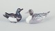 Bing og 
Grøndahl og 
Royal 
Copenhagen, to 
ænder af 
porcelæn.