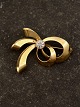 14 karat guld 
broche med 
zirkon