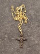 Gold-plated 
sterling silver 
cross with 
garnets