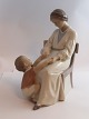 Bing & Gröndahl. Porcelain figurine. Mother and child. Model 1642. Height 23 cm. 
(1 quality).