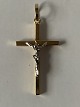 Gold cross in 18 carat red and white gold, and with beautiful details.
