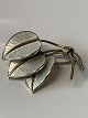 Beautiful 
timeless silver 
brooch with 
three beautiful 
leaves. The 
leaves are 
coated with 
white ...