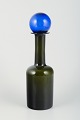 Otto Brauer for 
Holmegaard. 
Large bottle 
vase in 
bottle-green 
art glass with 
blue ...