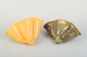 Two Kähler 
ceramic wall 
vases shaped 
like seashells.