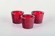 Scandinavian 
designer.
Three tealight 
holders in red 
glass.