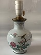 Chinese table 
lamp in 
porcelain with 
brass top and 
socket with 
bird
and flower 
motif. Stamped 
...
