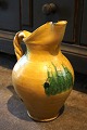 Old Italian 
ceramic wine 
jug with fine 
yellow glaze 
and ...